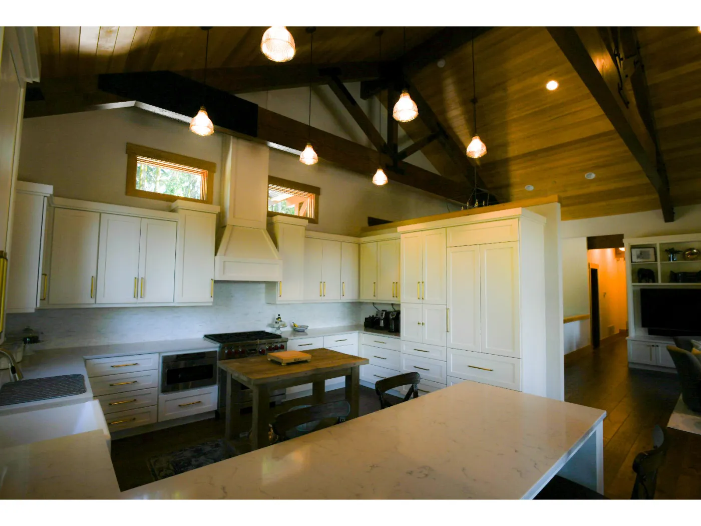 Issaquah kitchen: white cabinets under the timber trusses
